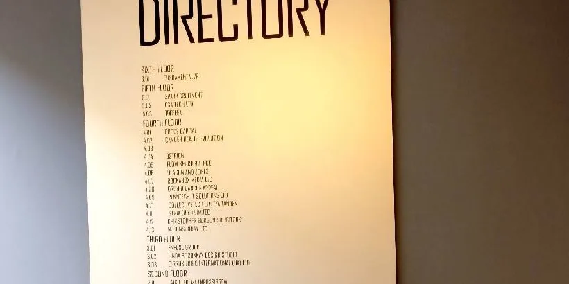 The directory board inside 60 Gray's Inn Road, without Resolve Money on it.